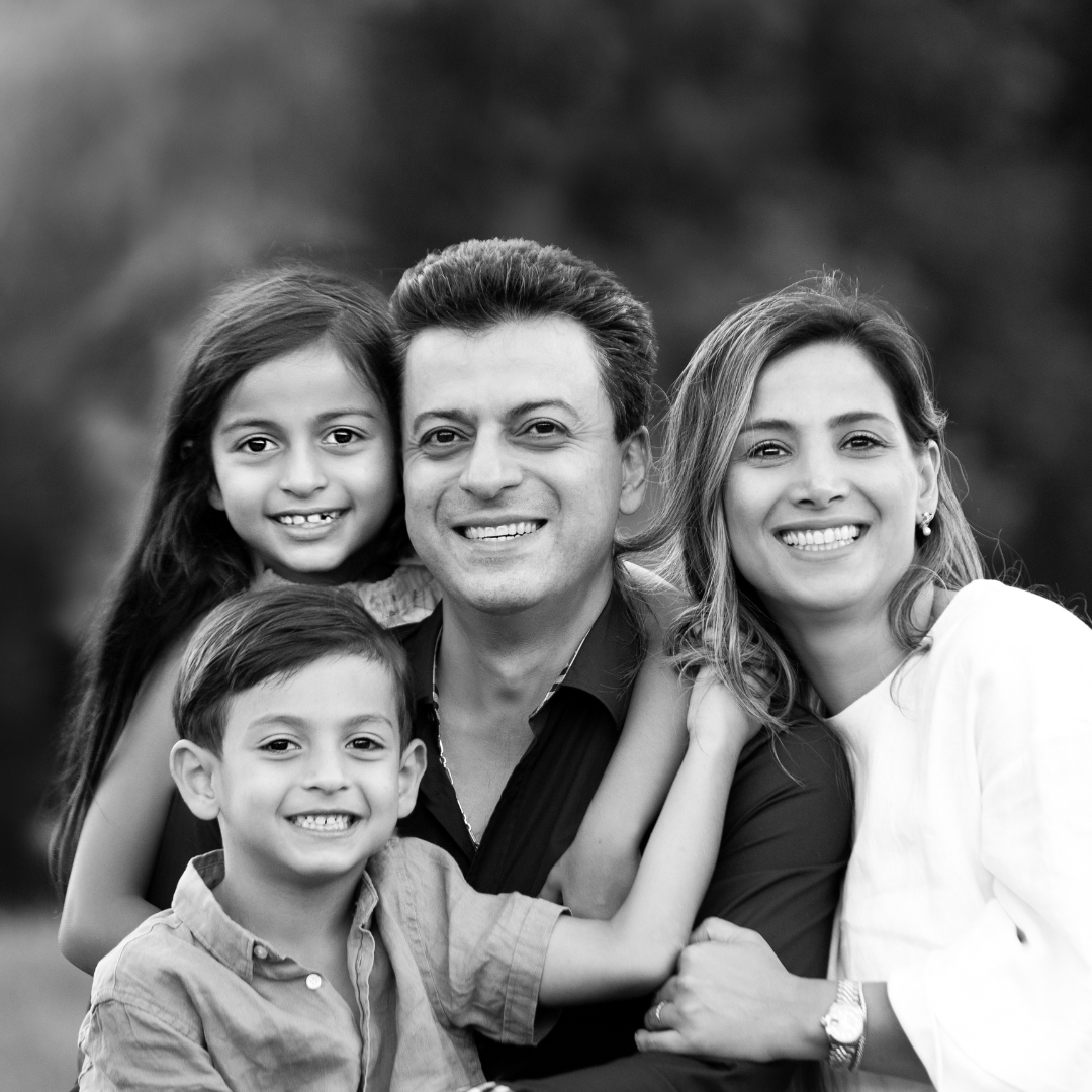 Dr Majid and Dr Sheyda with their children smiling