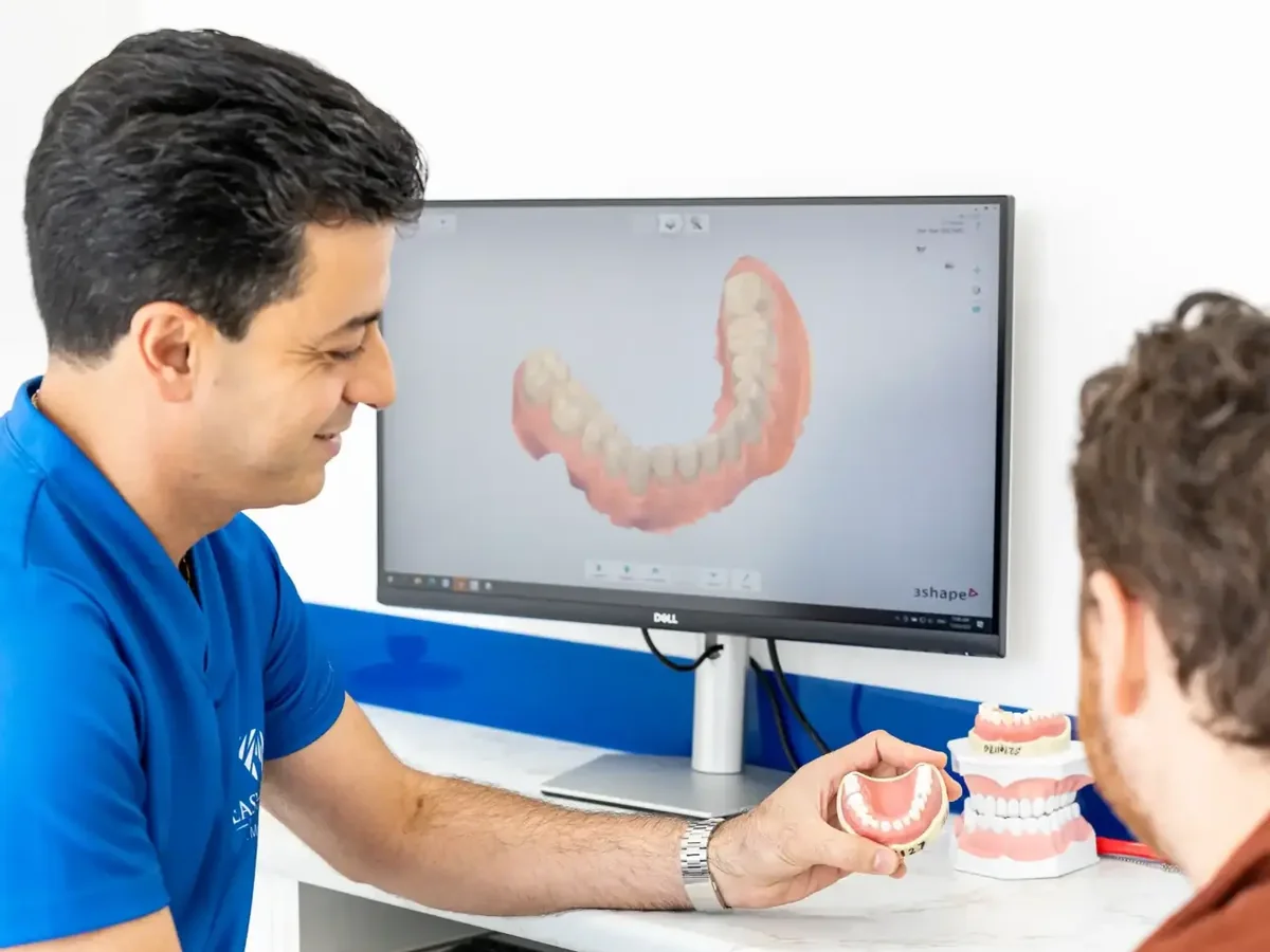 Dr Majid Serpoosh explaining a dental model to a patient at EasyCare